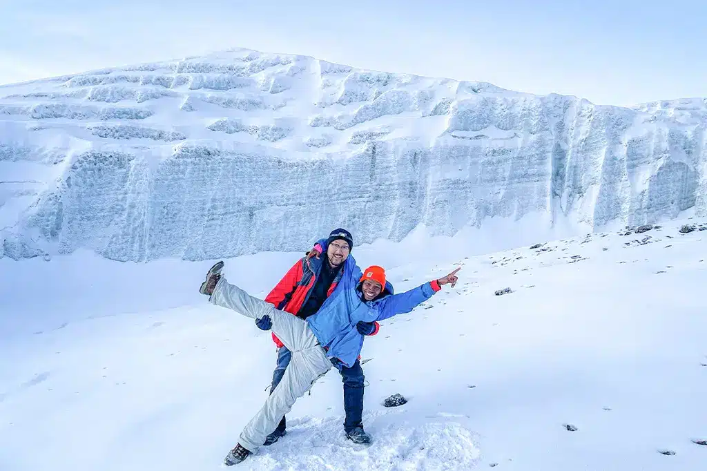 A group of hikers trekking through the glacier trails of Mount Kilimanjaro 1.jpg