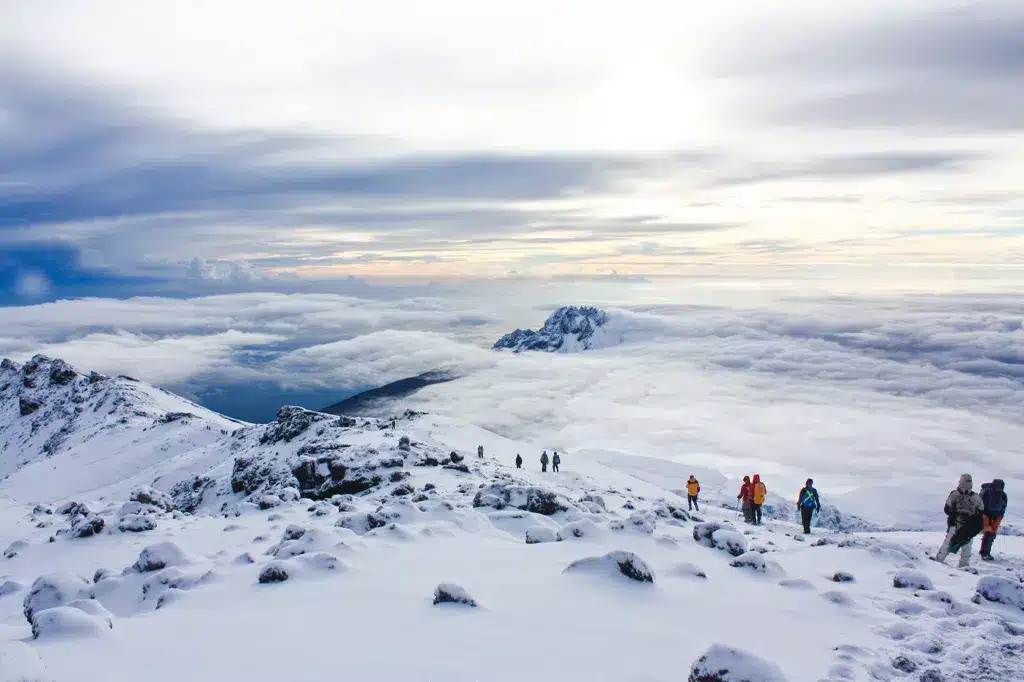 Hikers are descending from Uhuru Peak on Mount Kilimanjaro Tanzania.jpg