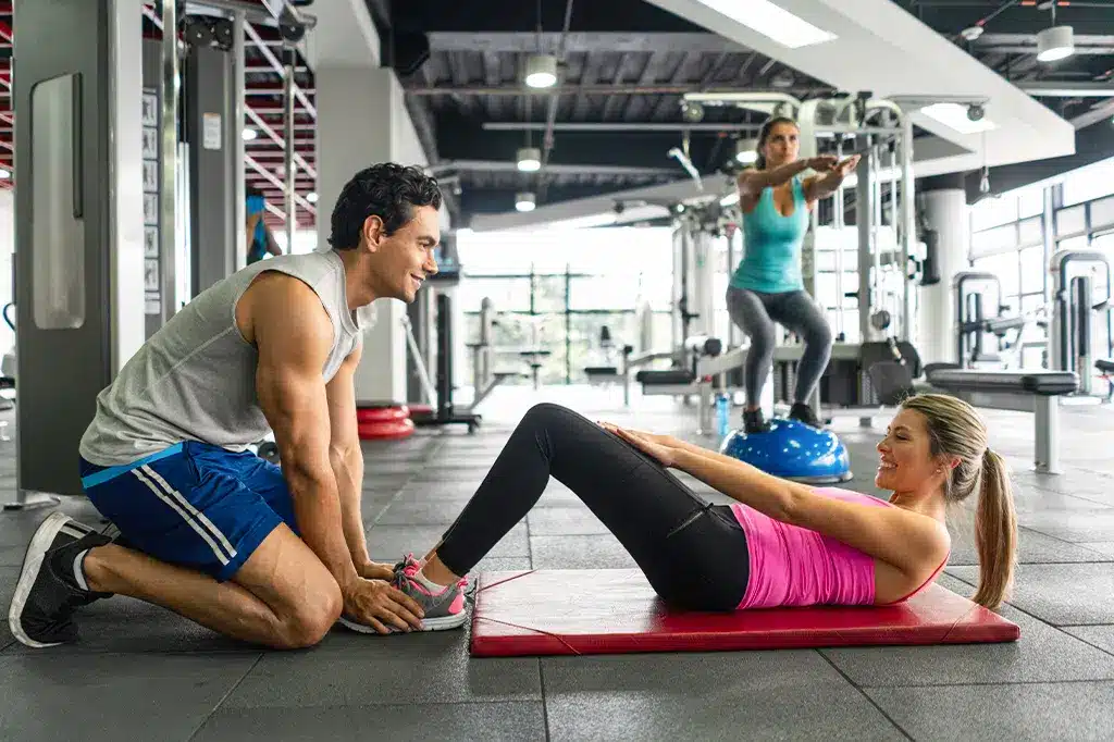 Young couple exercising at the gym.jpg