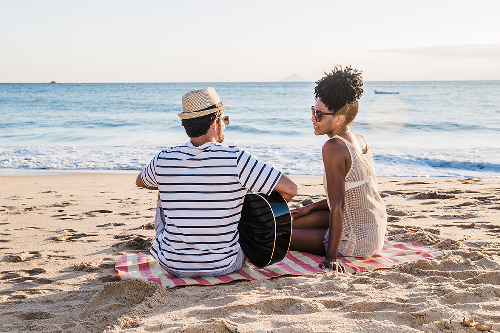 A young couple enjoying the sunset on Pemba Island, Tanzania