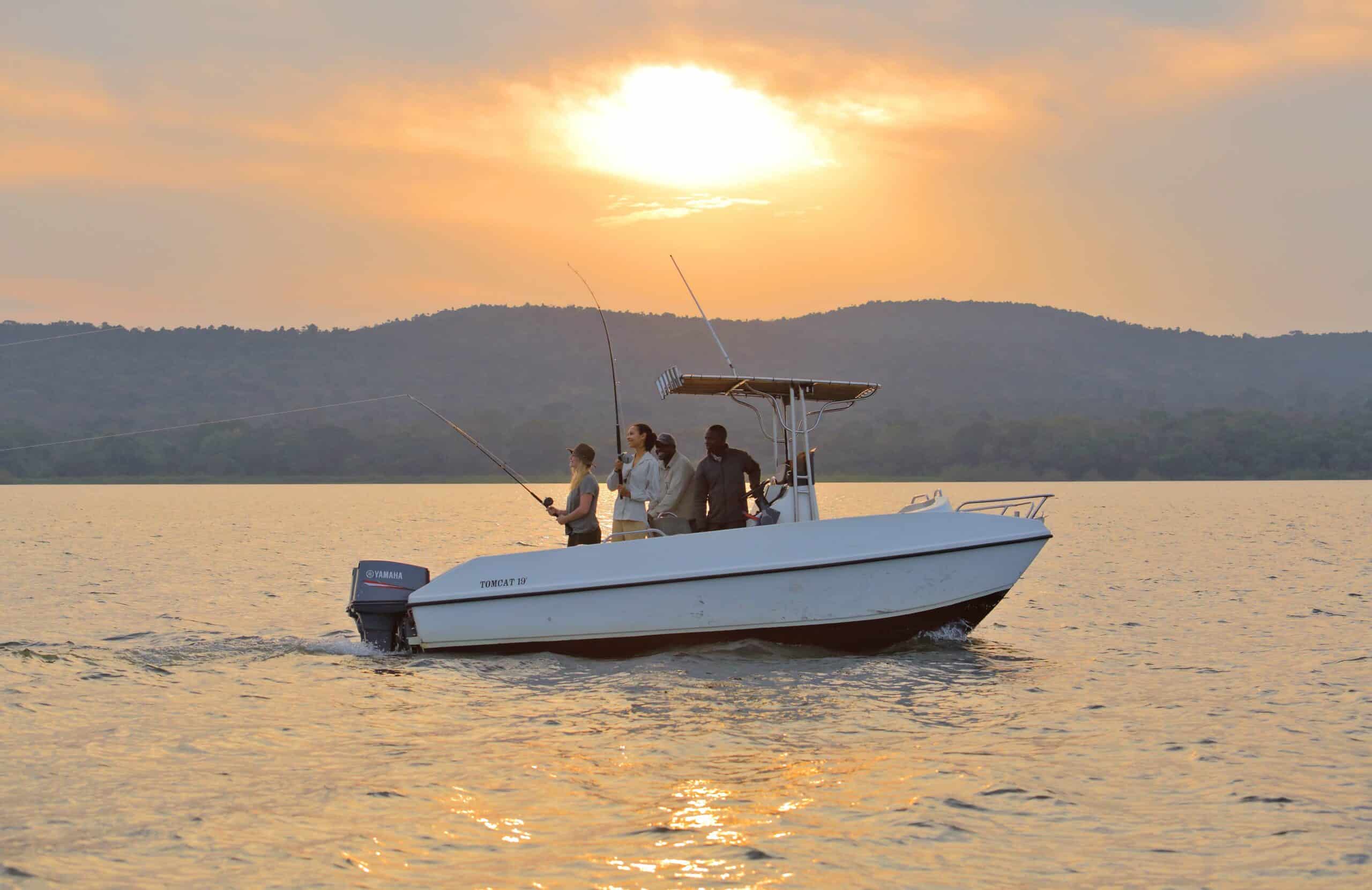 Guest enjoying a fishing expedition at Rubondo Island National Park