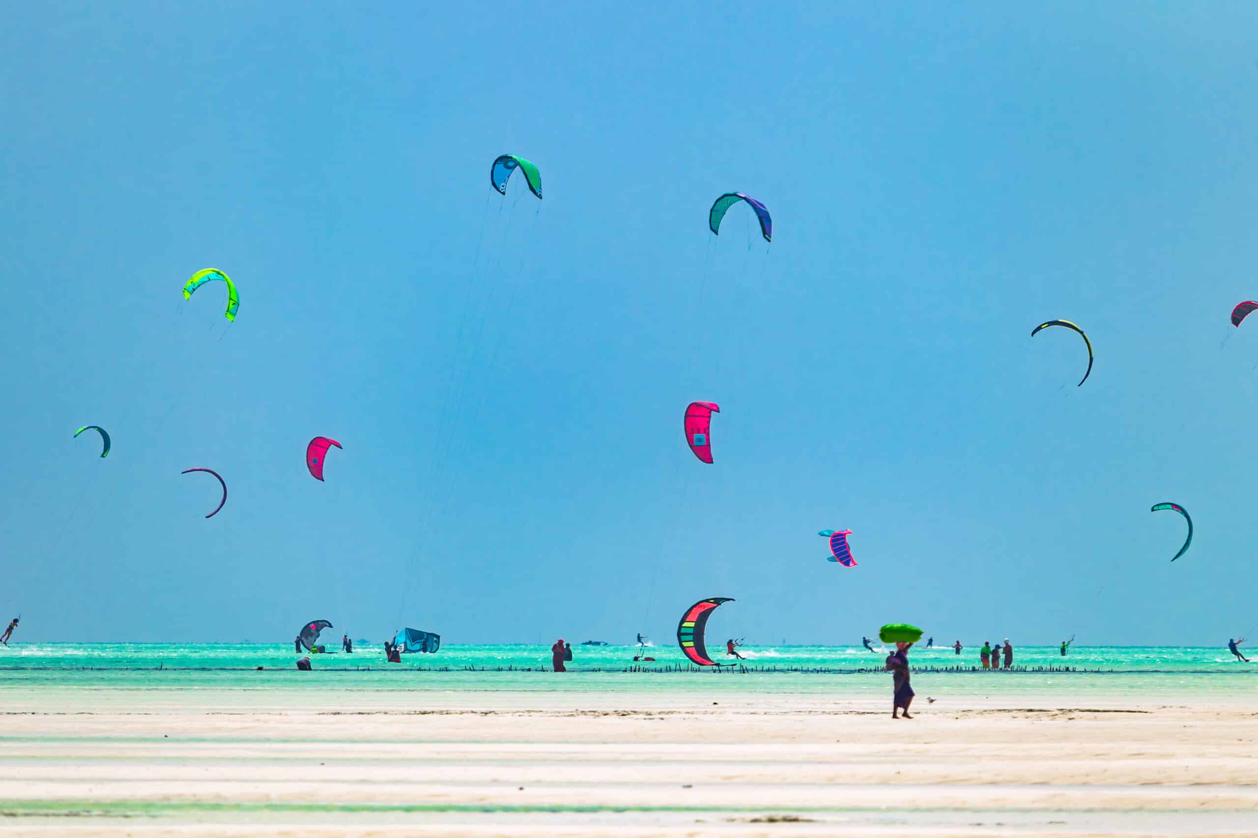Kiteboarders riding the waves at Paje Beach Zanzibar
