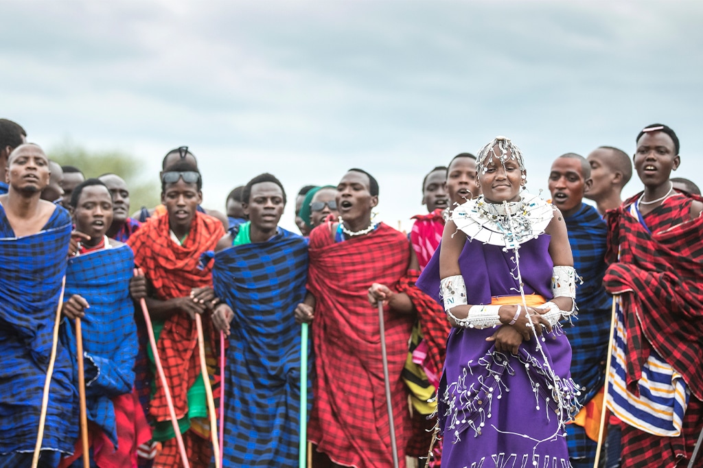 Maasai warriors chanting and dancing at serengeti national park, tanzania