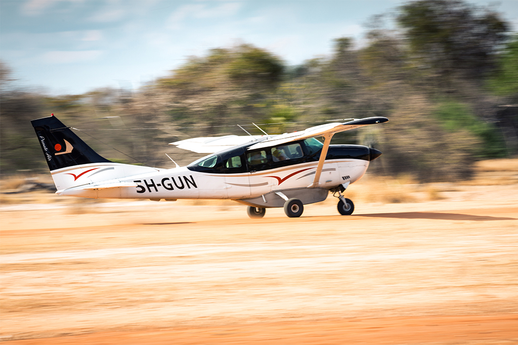 Small propeller airplane taking off from Pemba Island Tanzania Small propeller airplane taking off from Pemba Island, Tanzania