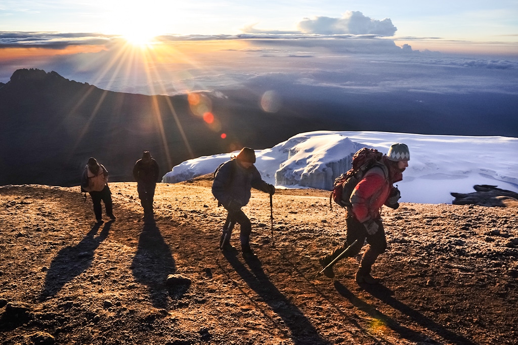 A group of hikers hiking to Uhuru Peak of Mount Kilimanjaro, Tanzania