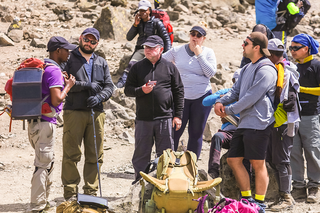 Kilimanjaro guide interacting with the hikers 1 Kilimanjaro guide interacting with the hikers