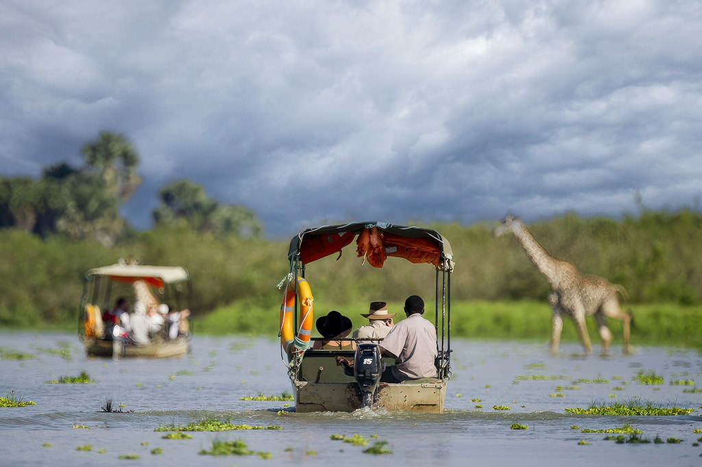 Boat safari beneath the rain clouds at Katavi National Park, Tanzania