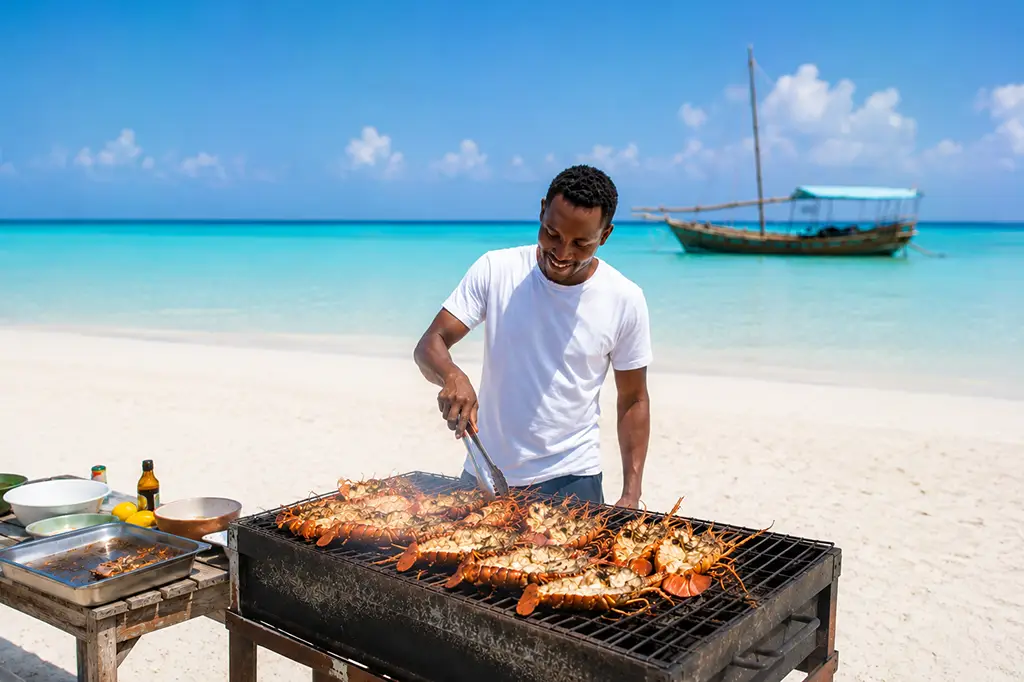 Easy Travel Chef Grilling Lobsters at Nakupenda Sandbank Zanzibar Easy Travel Chef Grilling Lobsters at Nakupenda Sandbank, Zanzibar