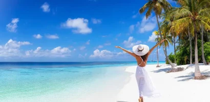 A-young-woman-tourist-on-the-white-sandy-beach-of-Zanzibar-Tanzania.jpg
